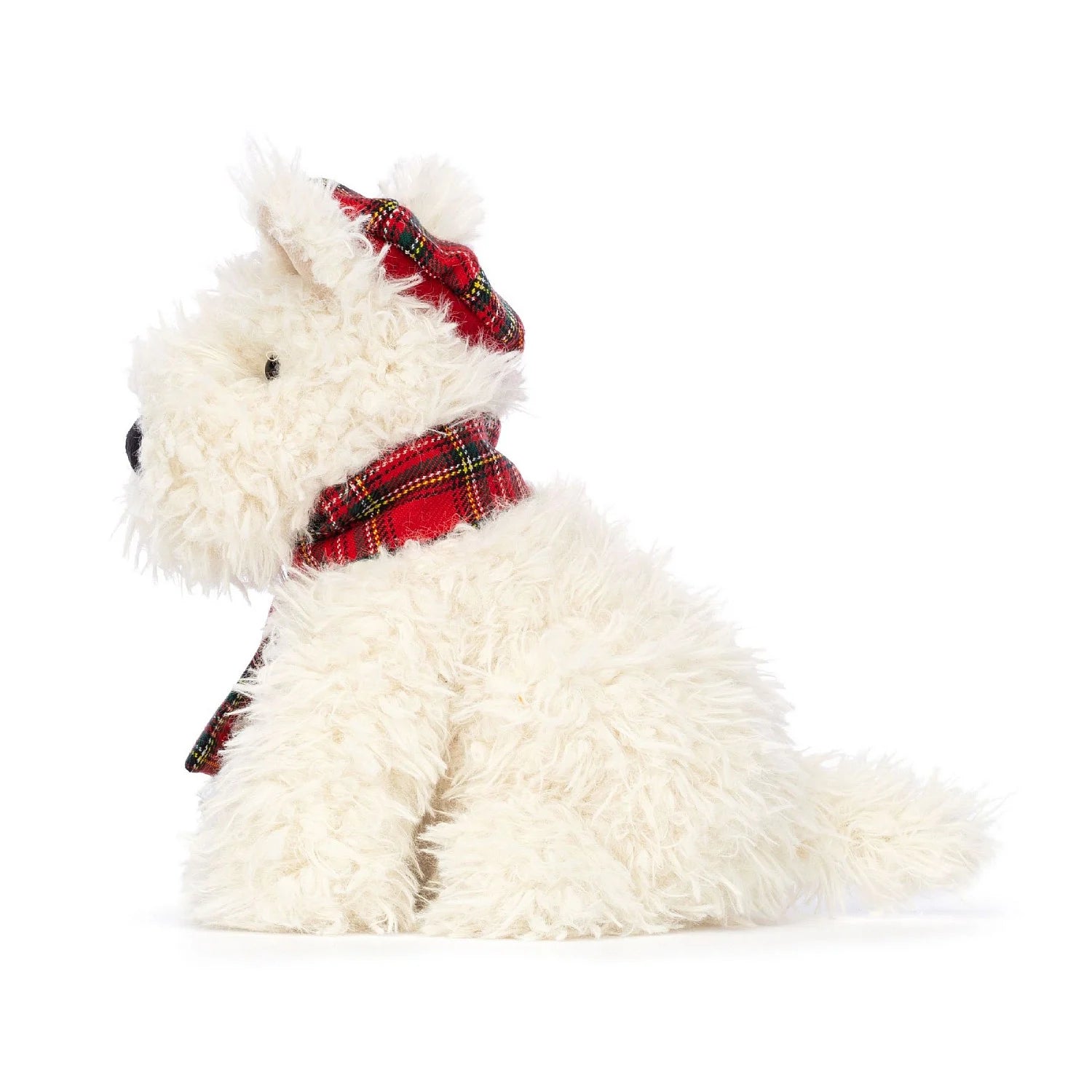 Side-view: Munro the Scottie Dog is a white plush stuffed dog with luxurious fur. This Winter Warmer version of Munro Scottie Dog adds an extra stylish red tartan plaid scarf around its neck. Munro's floppy ears and wagging tail give it an endearing and playful appearance. Its high-quality craftsmanship and attention to detail make it a fantastic choice for dog lovers of all ages.
