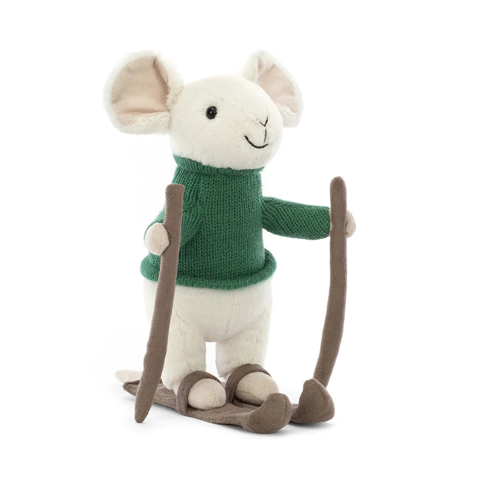 An adorable plush toy of a white mouse dressed in a cozy green sweater and skis strapped to its tiny feet. Its white fur contrasts beautifully with the vibrant green sweater. The merry mouse has a cheerful expression, with its sparkling black eyes and a sweet little nose peeking out from its furry face. As it glides down the slopes, the mouse's long tail playfully trails behind.